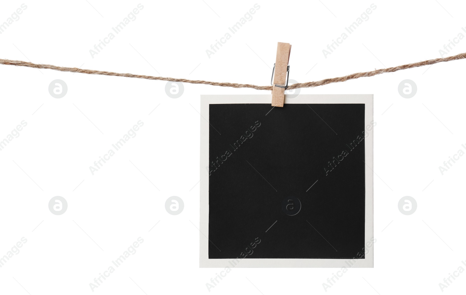 Photo of Clothespin with empty instant frame on string against white background. Space for text