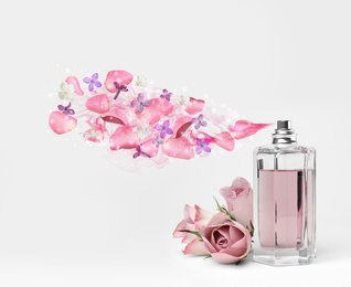 Perfume with floral scent on white background