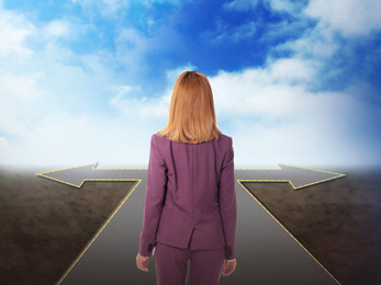 Image of Choose your way. Woman standing at crossroads taking important decision