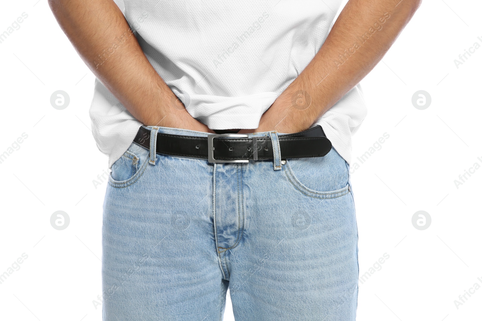 Photo of Man scratching crotch on white background, closeup. Annoying itch