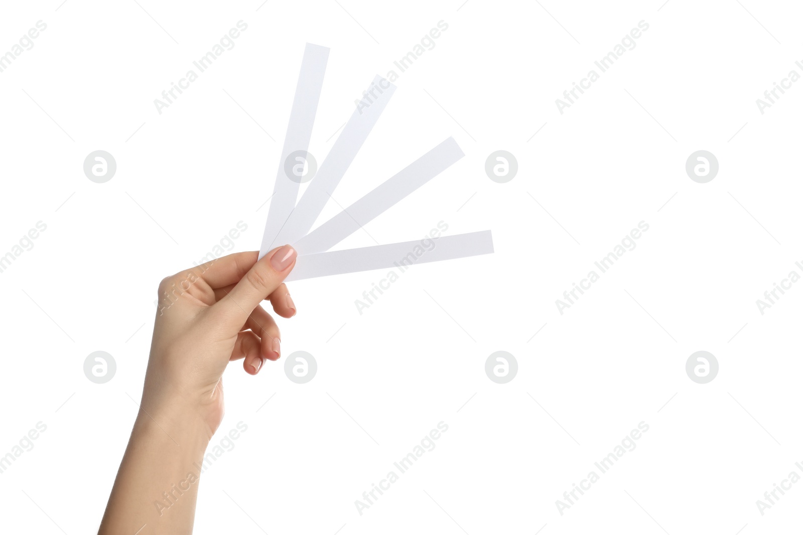 Photo of Woman holding perfume testing strips on white background, closeup