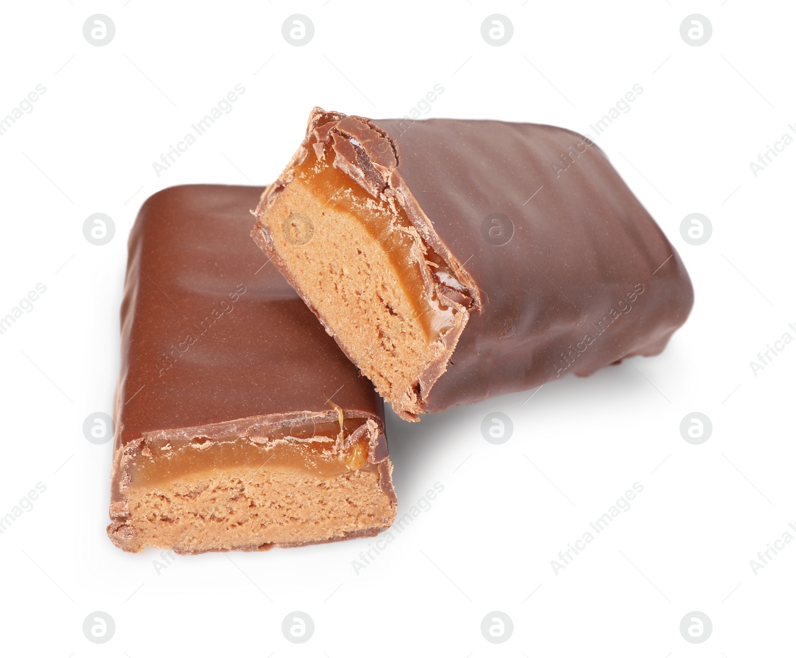 Photo of Pieces of tasty chocolate bars with nougat on white background