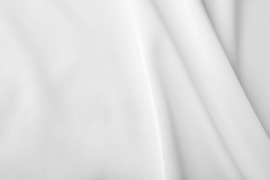 Photo of Texture of white silk ripple fabric as background, closeup