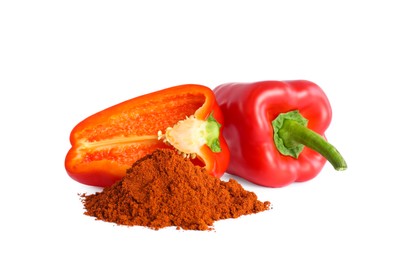 Photo of Fresh bell peppers and paprika powder on white background