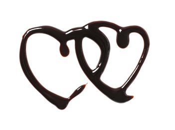 Hearts made of dark chocolate on white background, top view