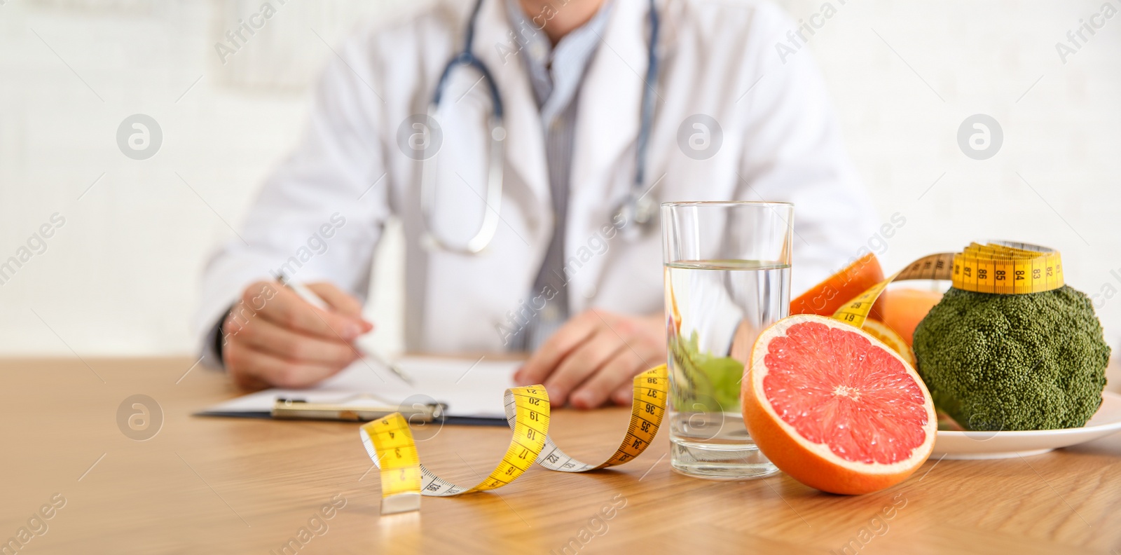 Image of Healthy products, measuring tape and blurred nutritionist on background. Banner design