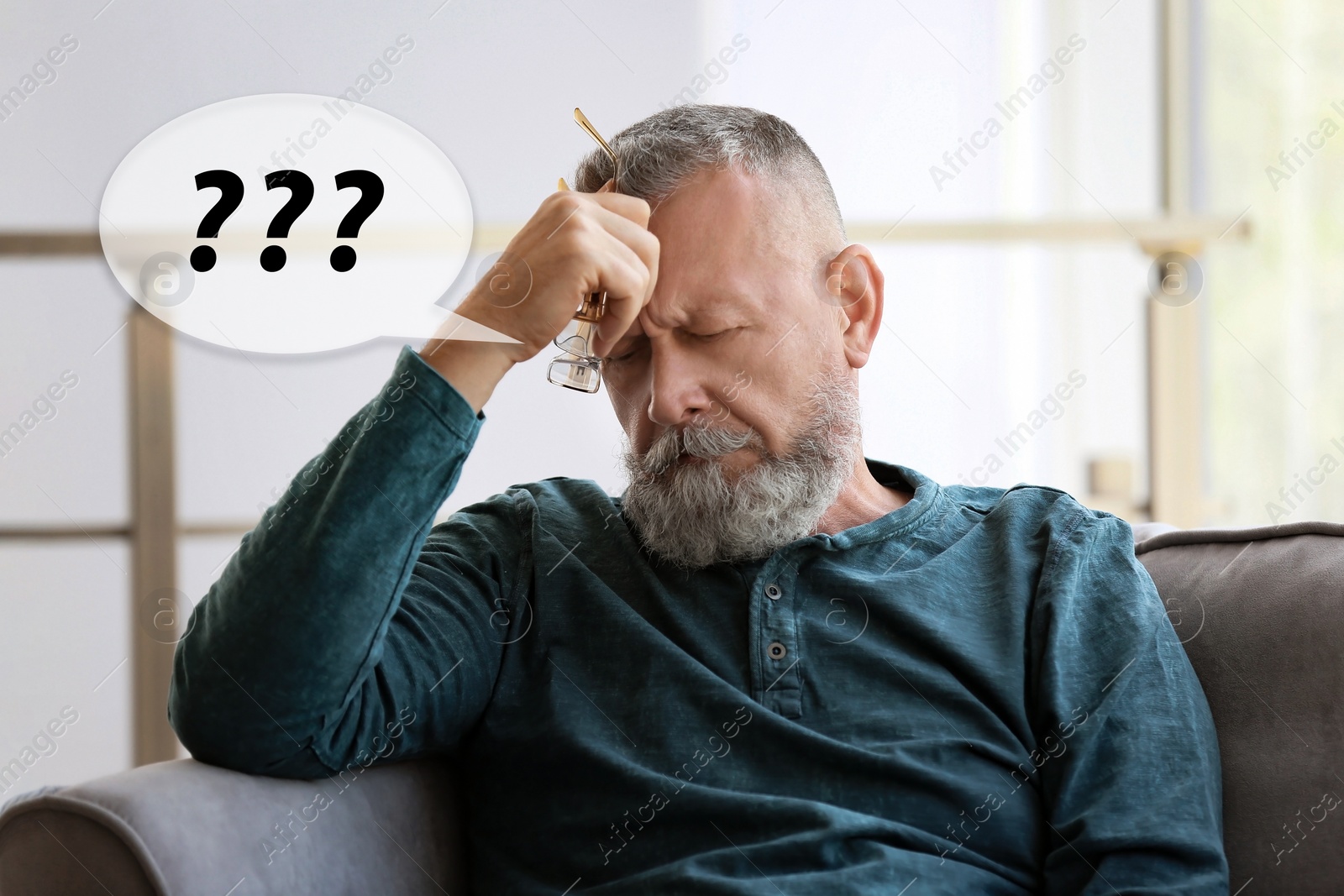 Image of Senior man suffering from dementia at home. Illustration of speech bubble with question marks