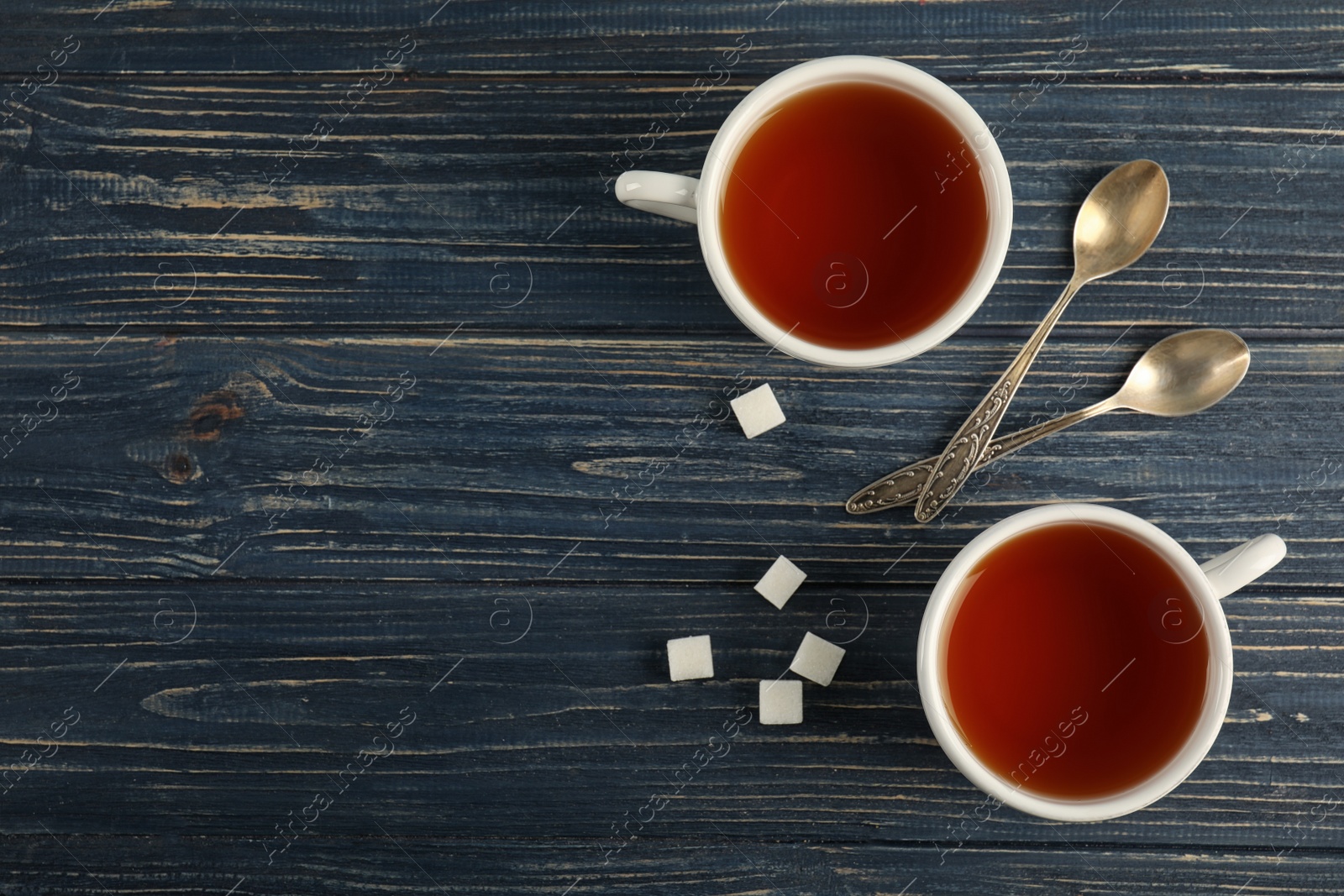 Photo of Flat lay composition with delicious tea on wooden background