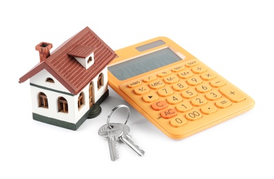 Photo of Calculator, keys and house model on white background. Real estate agent concept