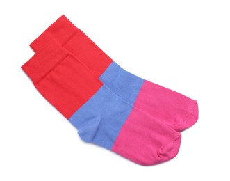 Photo of Pair of colorful striped socks on white background, top view