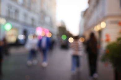 Photo of Blurred view of people walking on city street