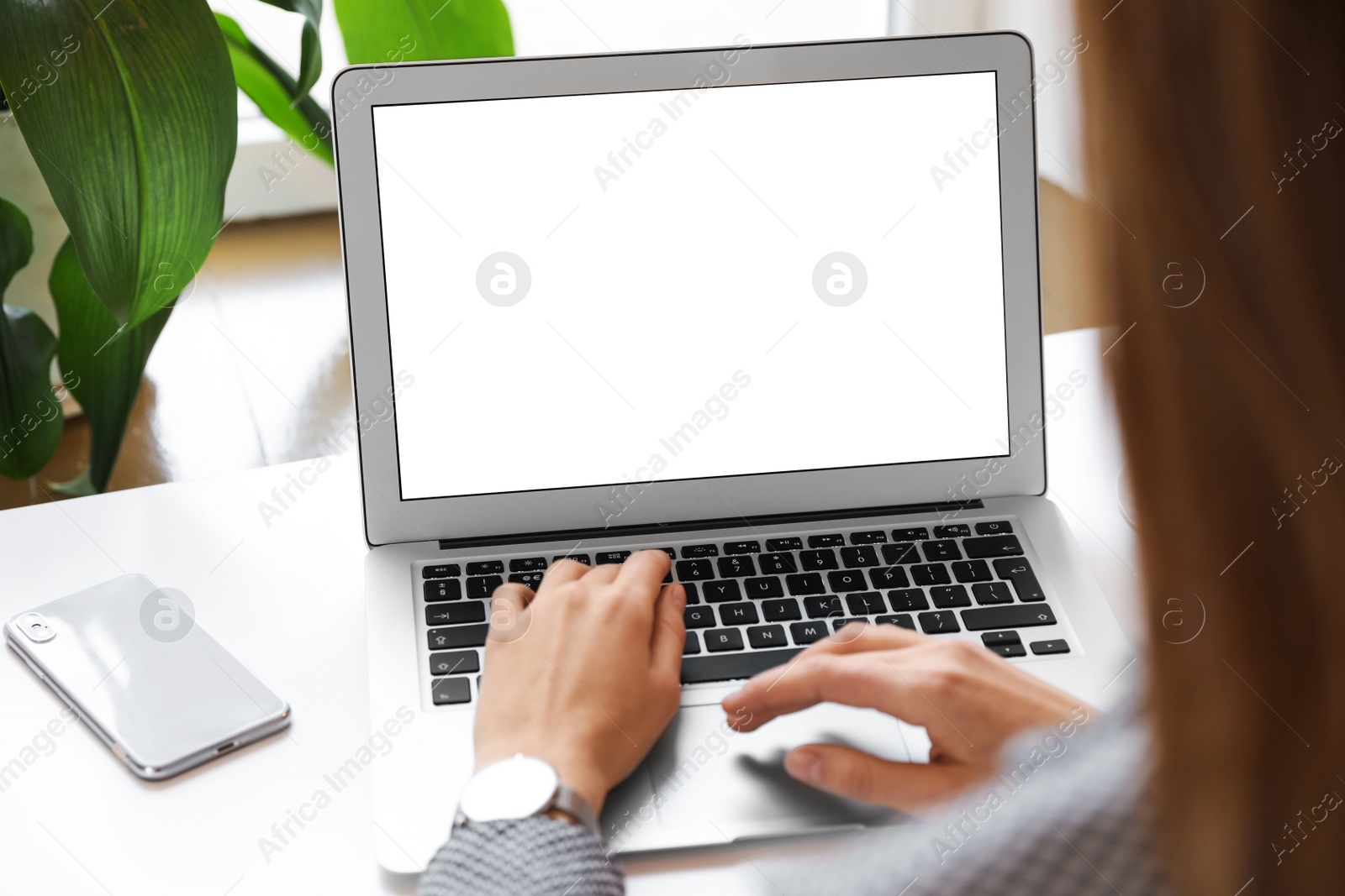 Image of Young woman using modern computer at table in office, closeup. Space for design