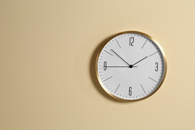 Photo of Stylish clock and space for text on color background. Time management