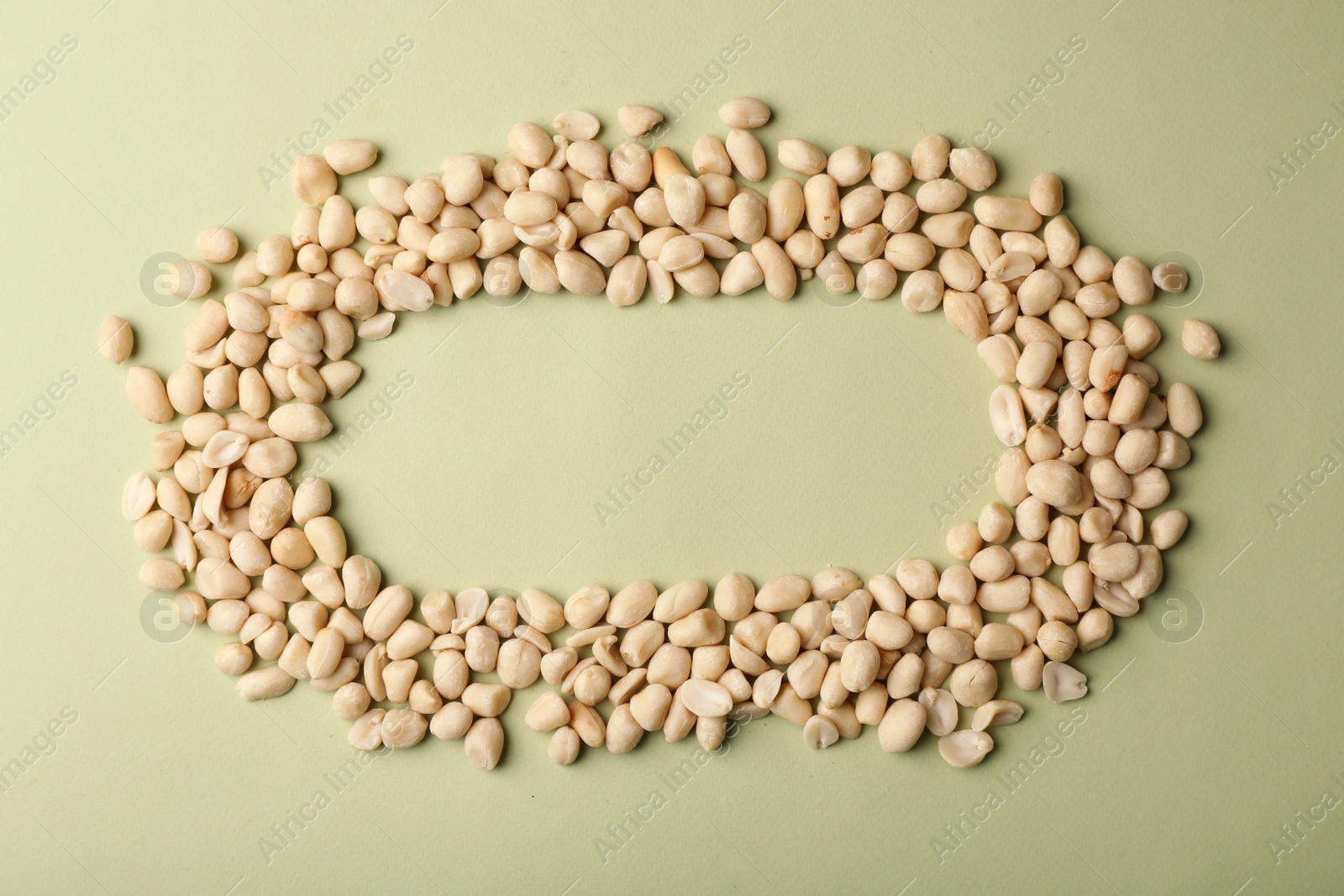 Photo of Composition with peanuts and space for text on color background, top view