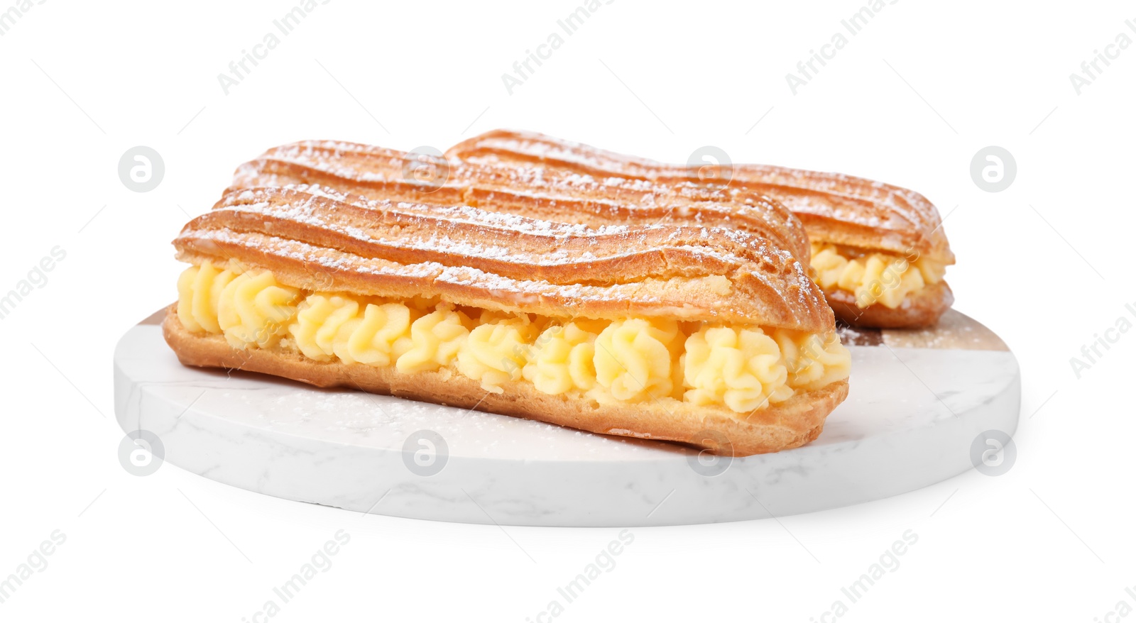 Photo of Delicious eclairs filled with cream isolated on white