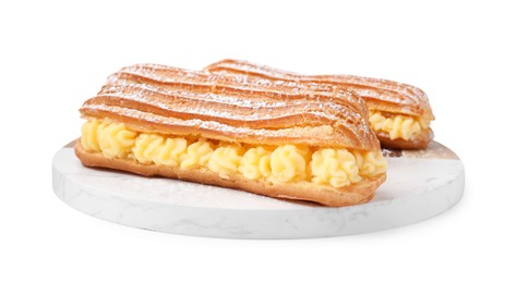 Photo of Delicious eclairs filled with cream isolated on white