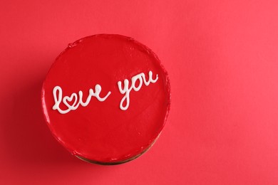 Bento cake with text Love You and space for text on red table, top view. St. Valentine's day surprise