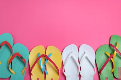 Photo of Many different flip flops on pink background, flat lay. Space for text