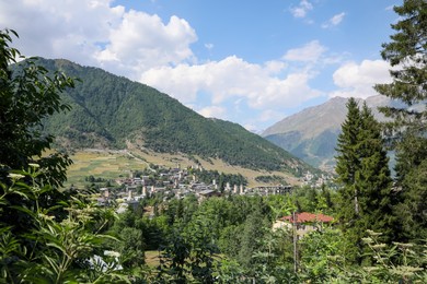 Photo of View of village in mountains on sunny day