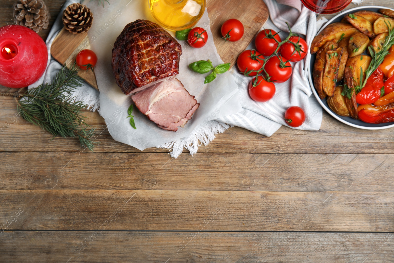 Photo of Festive flat lay composition with delicious ham on wooden table, space for text. Christmas dinner