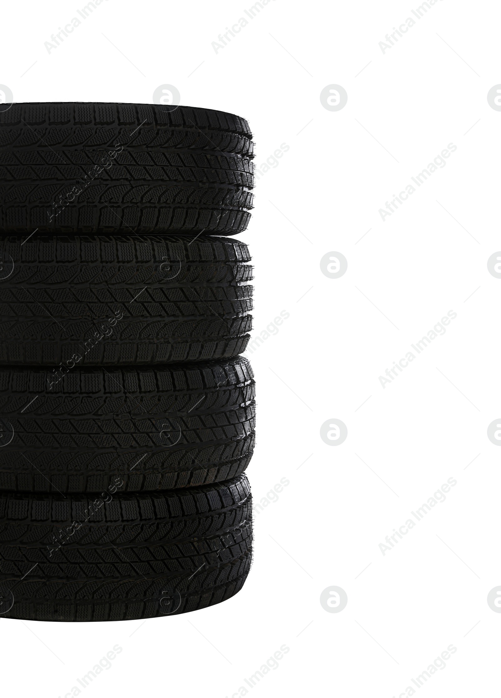 Photo of Set of new winter tires on white background