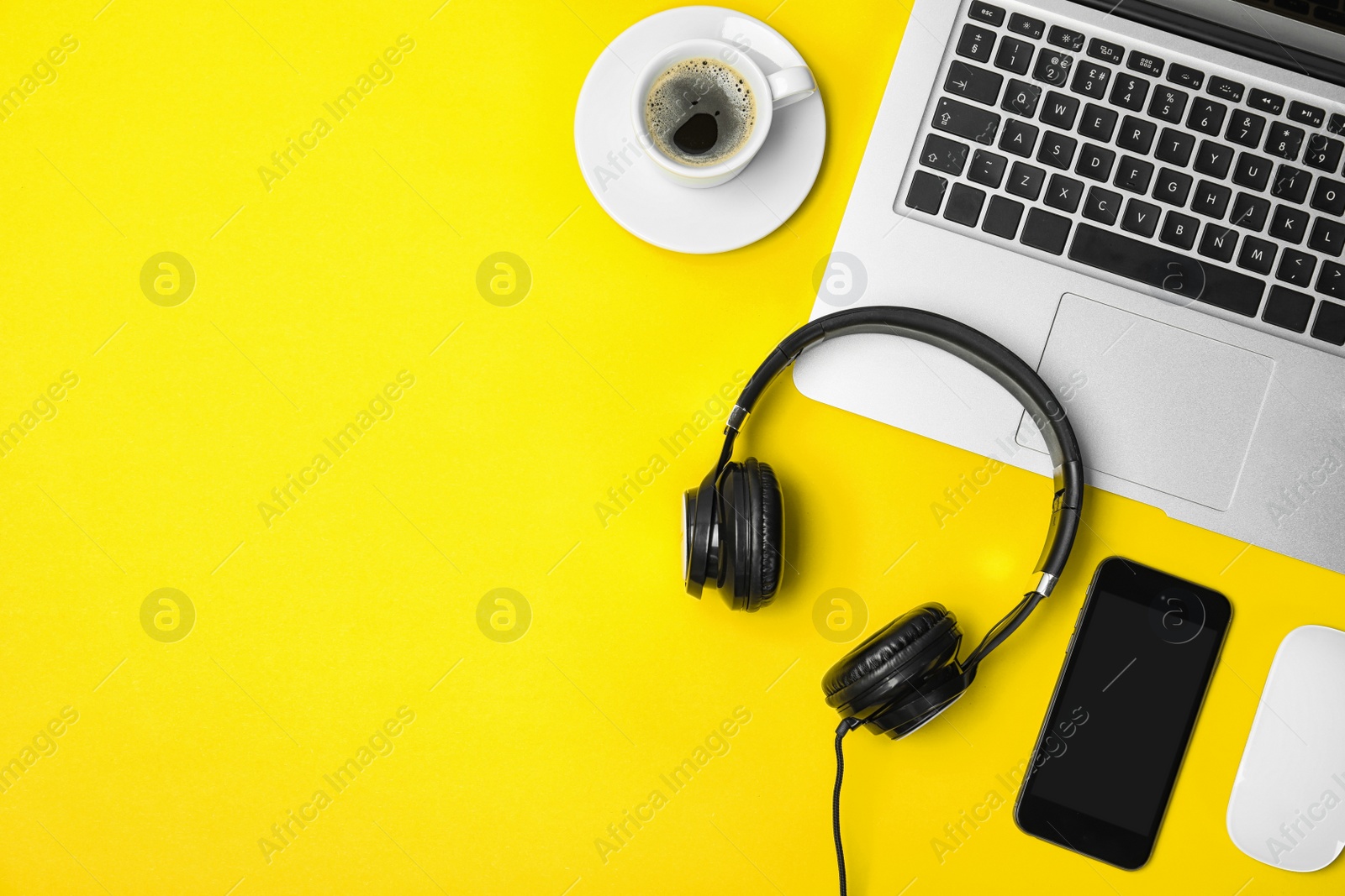 Photo of Flat lay composition with headphones, smartphone, laptop and space for text on color background