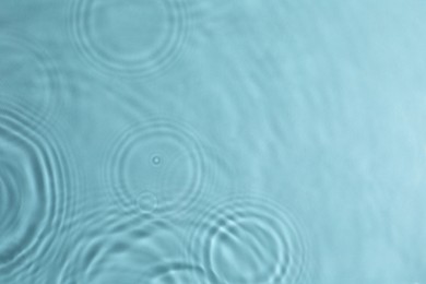 Photo of Closeup viewwater with circles on turquoise background. Space for text