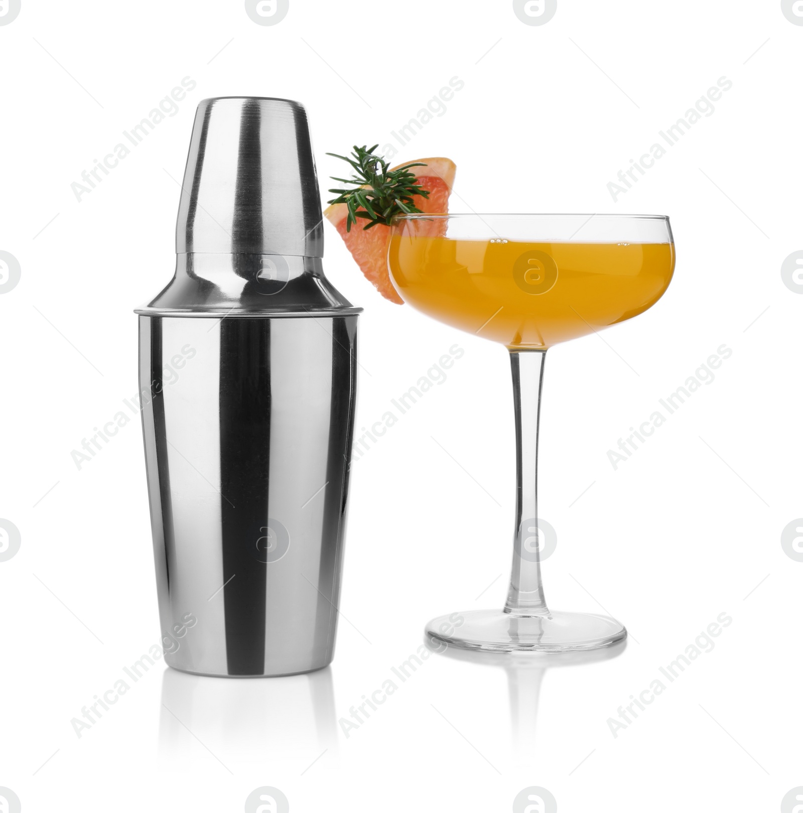 Photo of Metal shaker and delicious cocktail isolated on white