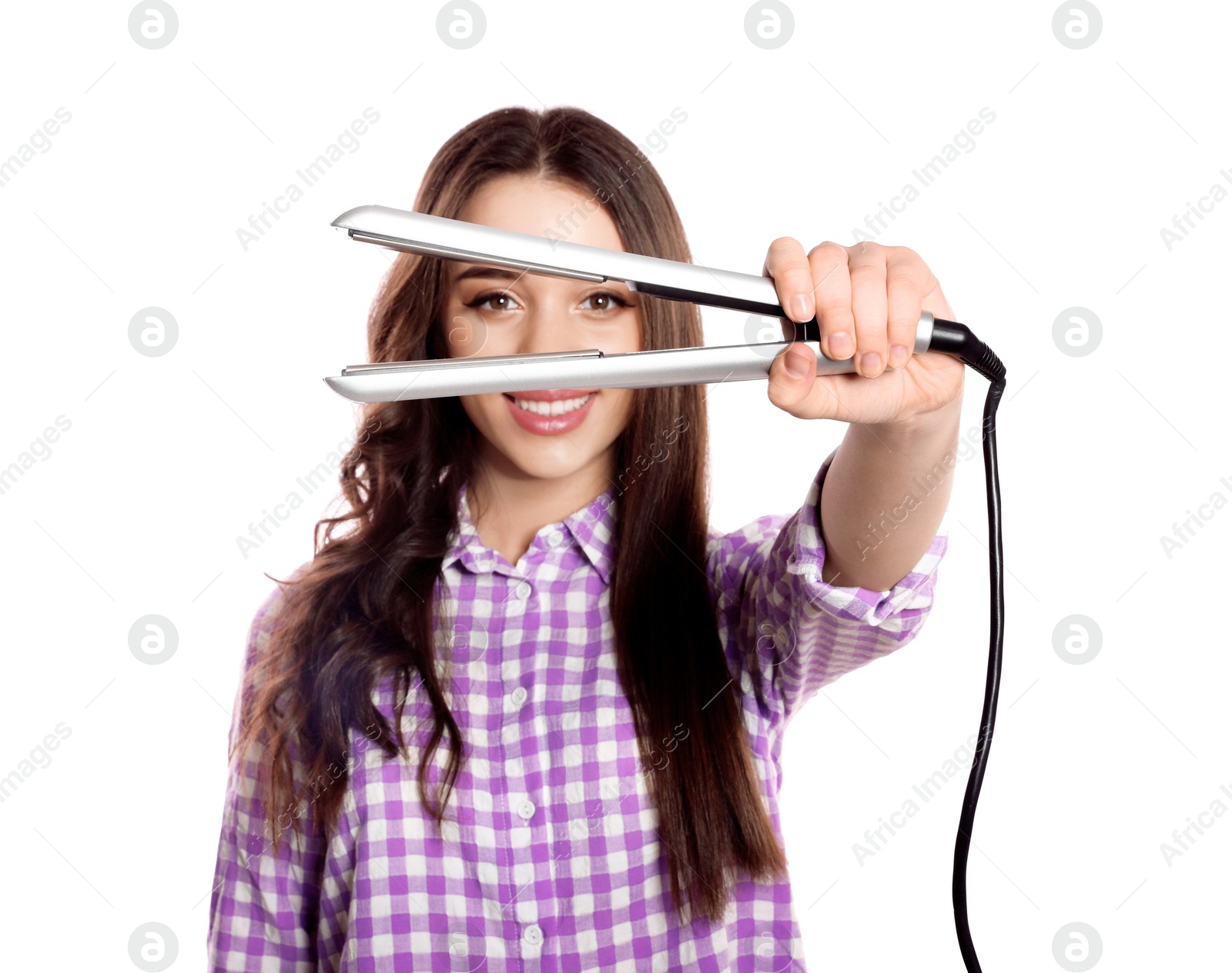 Photo of Happy woman with hair iron on white background