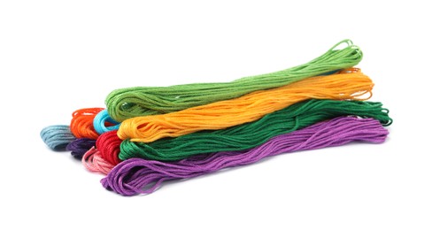 Photo of Set of colorful embroidery threads on white background