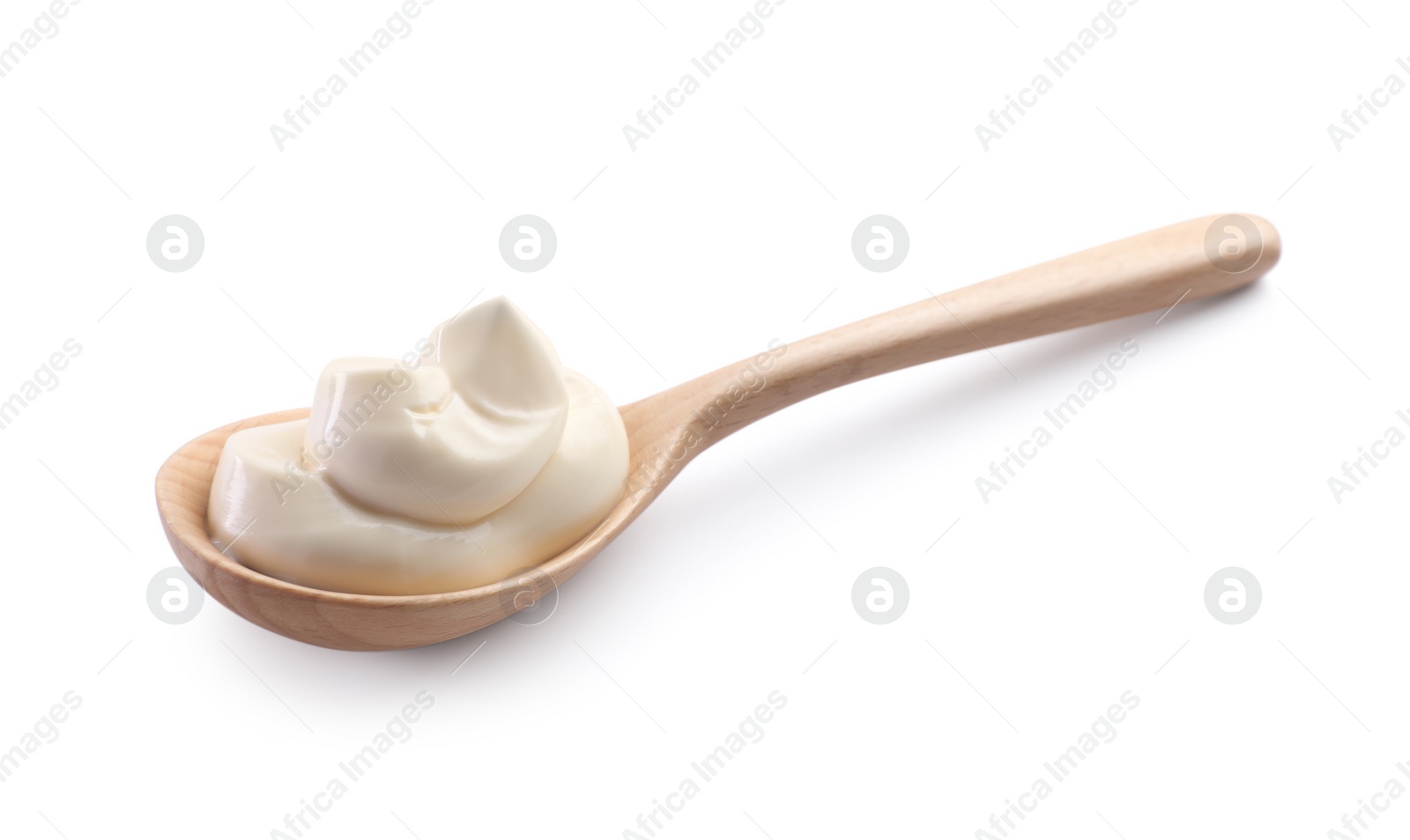 Photo of Natural yogurt in wooden spoon isolated on white