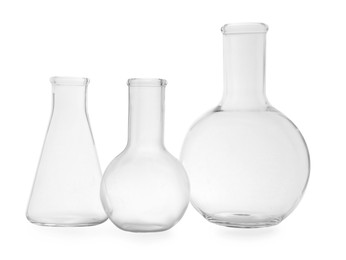 Photo of Empty flasks on white background. Laboratory equipment