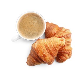 Fresh croissants and coffee isolated on white, top view. Tasty breakfast