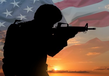 Image of Veterans Day. Silhouette of military man on sunset outdoors and flag of USA, double exposure