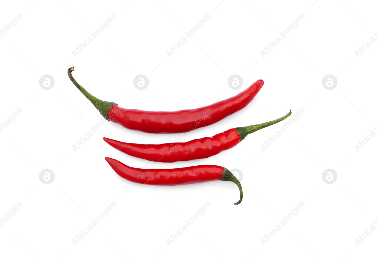 Photo of Red hot chili peppers isolated on white, top view