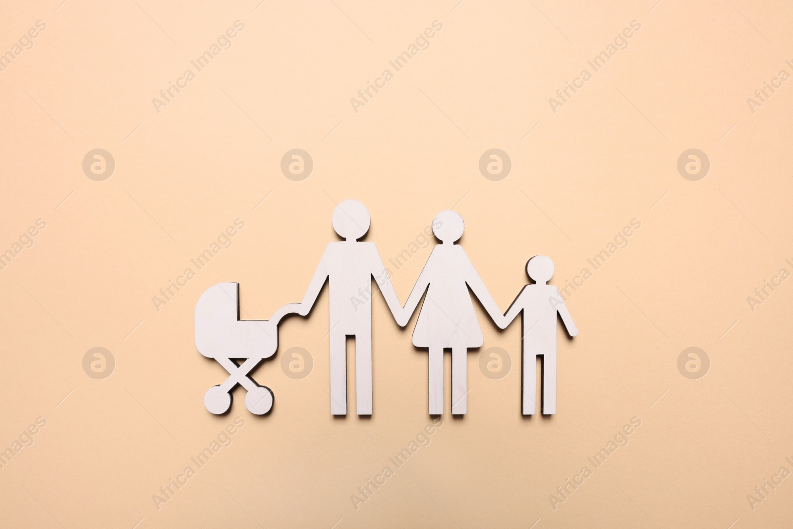 Photo of Figures of family on beige background, top view. Insurance concept