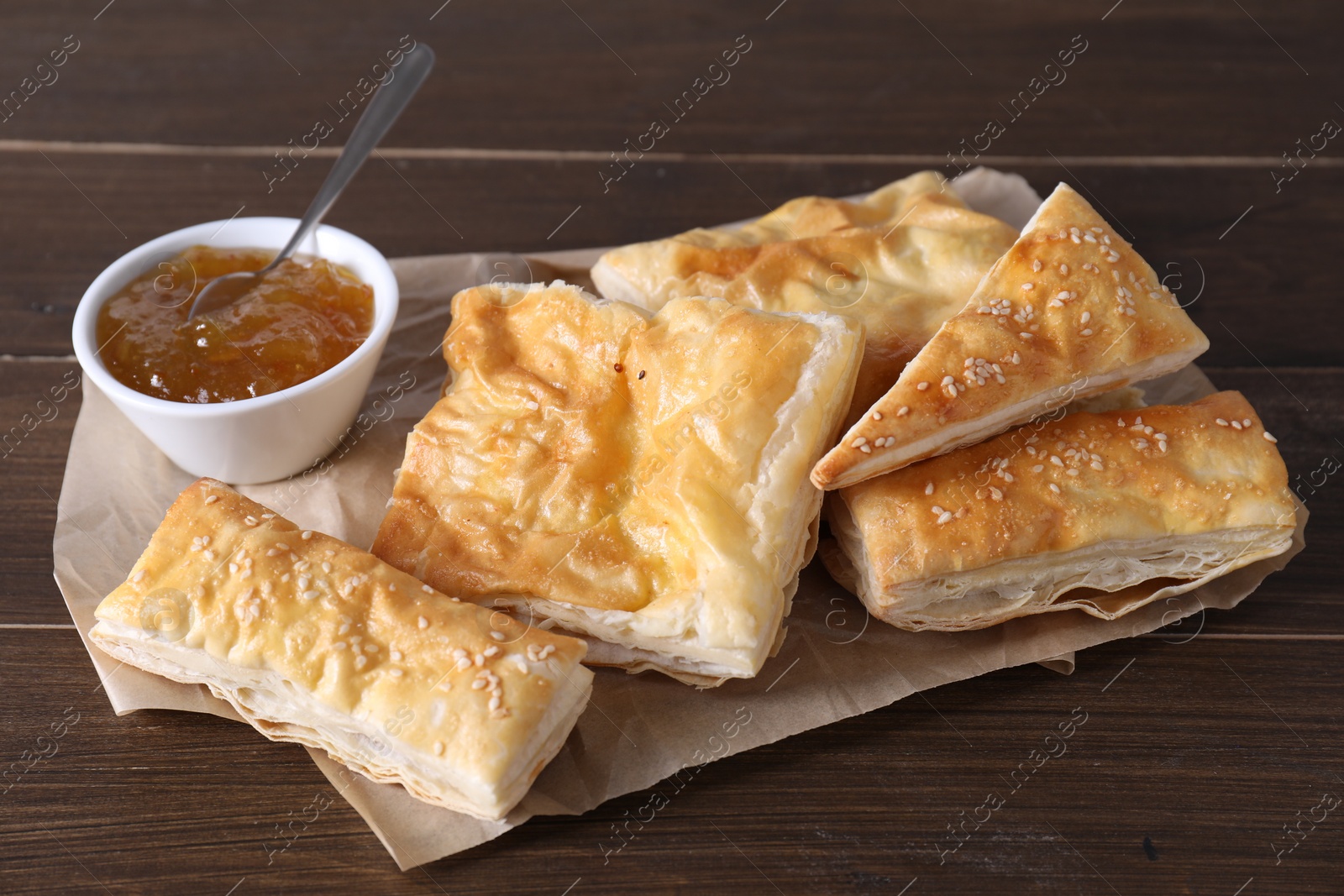 Photo of Delicious puff pastry served on wooden table