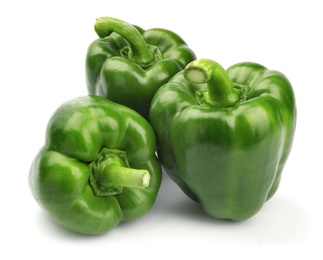 Photo of Ripe green bell peppers on white background