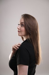 Photo of Portrait of beautiful woman on gray background