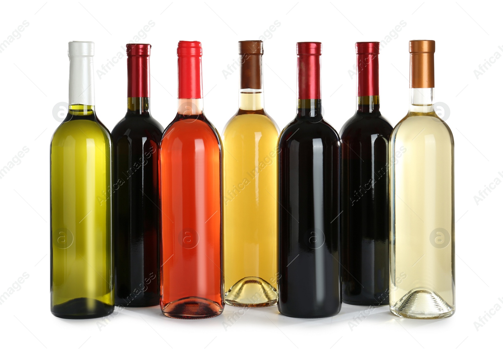 Photo of Bottles with different wine on white background