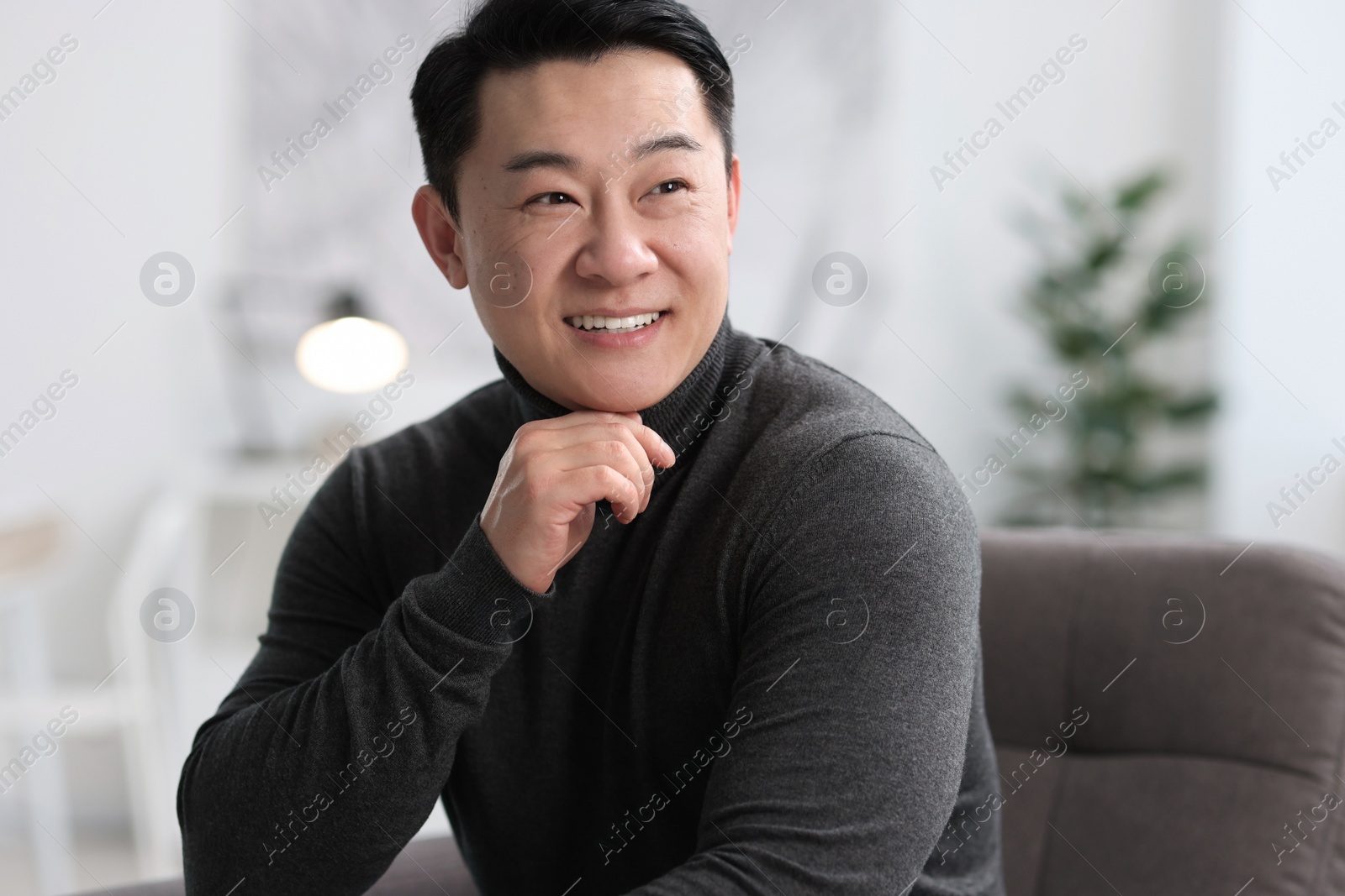 Photo of Portrait of smiling friendly businessman in office