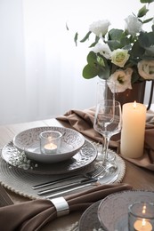 Photo of Festive table setting with beautiful floral decor in restaurant