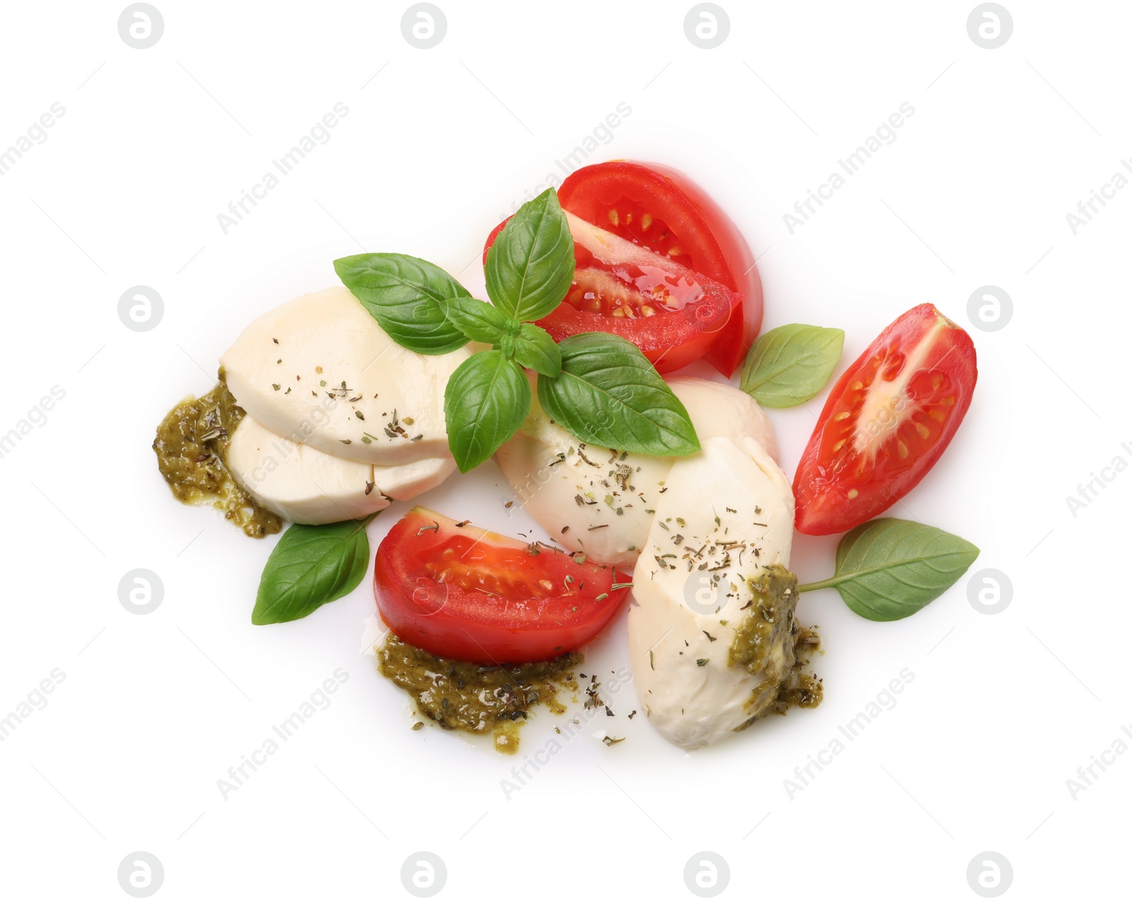 Photo of Tasty salad Caprese with mozzarella, tomatoes, basil and pesto sauce isolated on white, top view