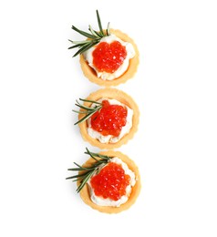 Photo of Delicious tartlets with red caviar and cream cheese on white background, top view