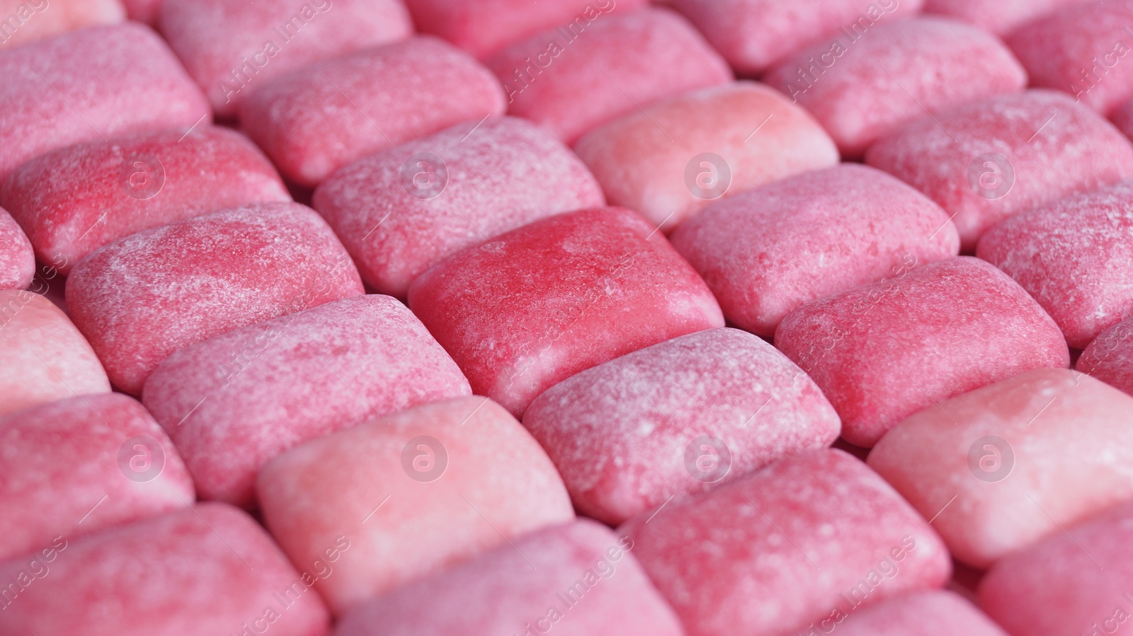 Photo of Many pink chewing gums as background, closeup