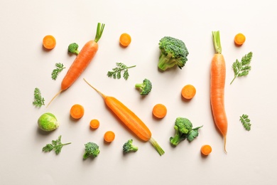 Flat lay composition with fresh vegetables on color background