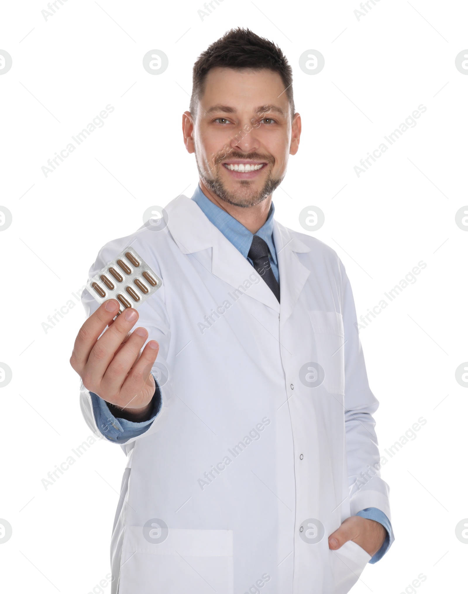 Photo of Professional pharmacist with pills on white background