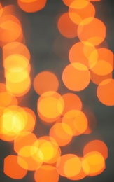 Photo of Beautiful gold lights on dark background. Bokeh effect