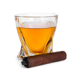 Photo of Glass of whiskey and burnt cigar isolated on white