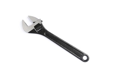 Photo of Adjustable wrench isolated on white. Plumbing supply